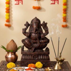 Hand-craved brown Vaagai Wood idol of Lord Ganesha in Padmasana